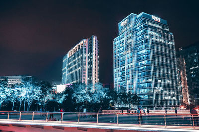 Illuminated buildings in city at night