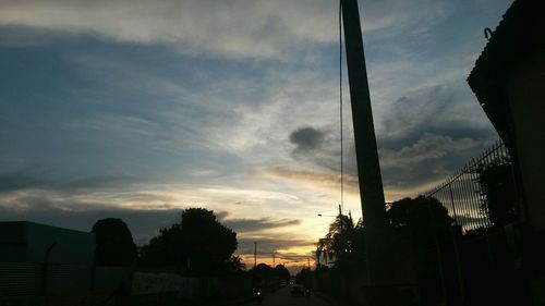 Low angle view of building against cloudy sky