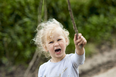 Portrait of cute baby boy outdoors