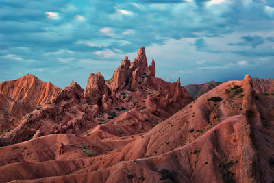 Panoramic view of rock formations against sky