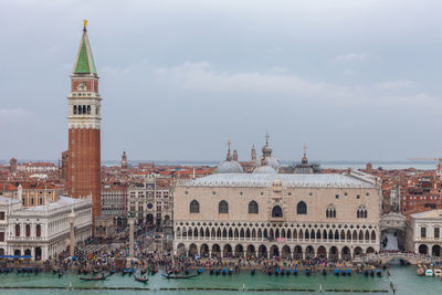 View of buildings against cloudy sky