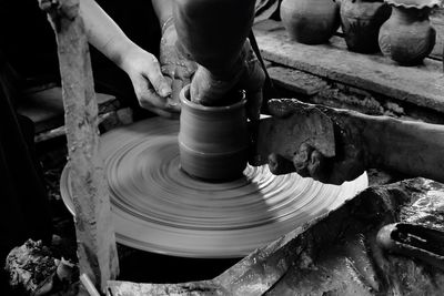 Close-up of people making pottery