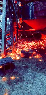 Close-up of burning candles on wood