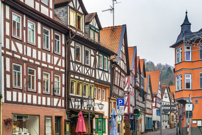 Street with historical half-timbered house in budingen, hesse, germany