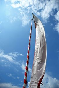 Low angle view of mast against blue sky