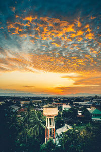 High angle view of buildings against sky during sunset