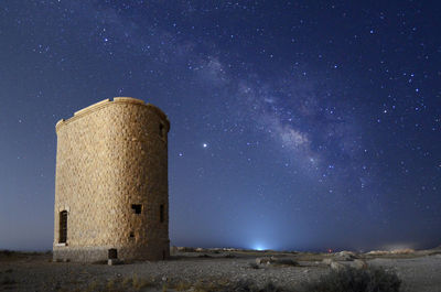 Old building in the desert and the milky way