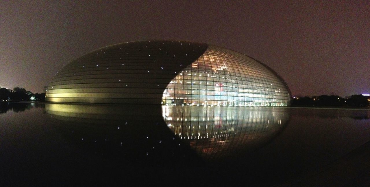illuminated, reflection, built structure, architecture, night, lighting equipment, indoors, pattern, circle, building exterior, no people, sky, glass - material, water, dark, electricity, glowing, copy space, light - natural phenomenon