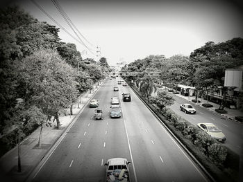 High angle view of vehicles on road in city