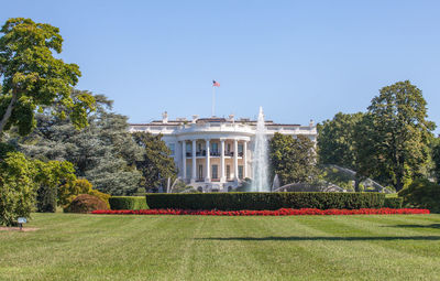 View to the white house from pennsylvania avenue, surrounded by green neat park, washington dc, usa