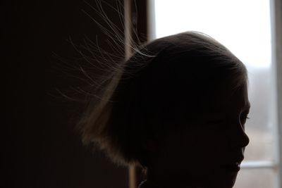 Close-up portrait of a girl at home