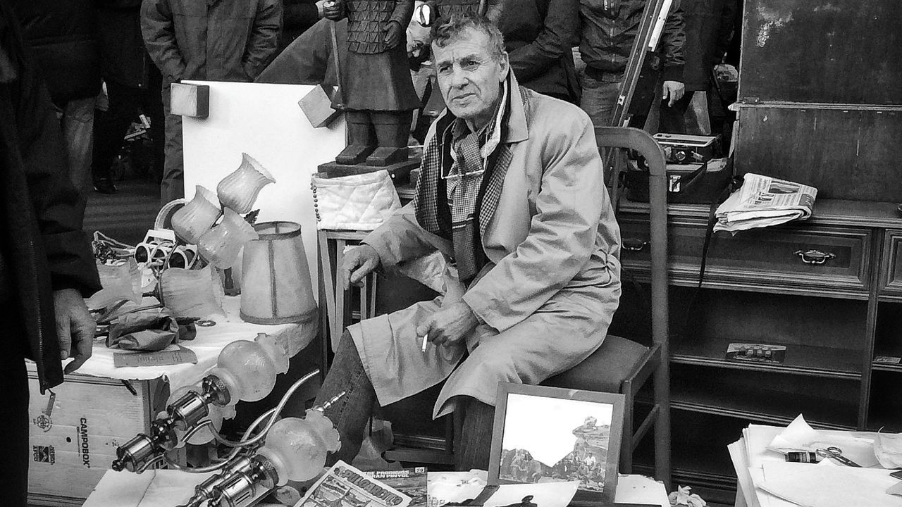 retail, market, for sale, market stall, men, large group of objects, abundance, indoors, store, shop, variation, choice, hanging, stack, small business, working, clothing, wood - material, day