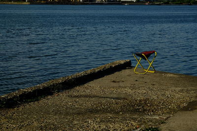 Chair at river bench