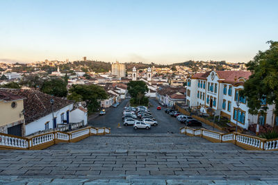 High angle view of street amidst buildings against sky