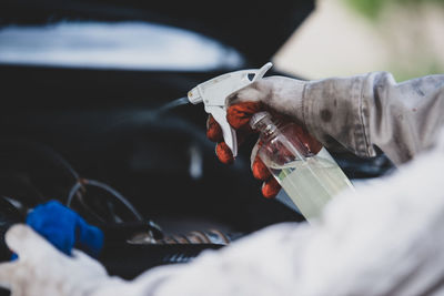 Close-up of man working in water