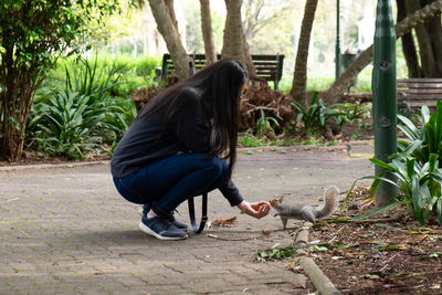 Woman with umbrella on plants