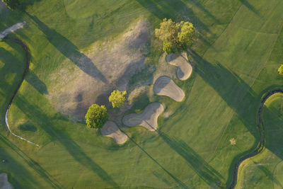 Aerial photographic documentation of a golf course taken at sunset