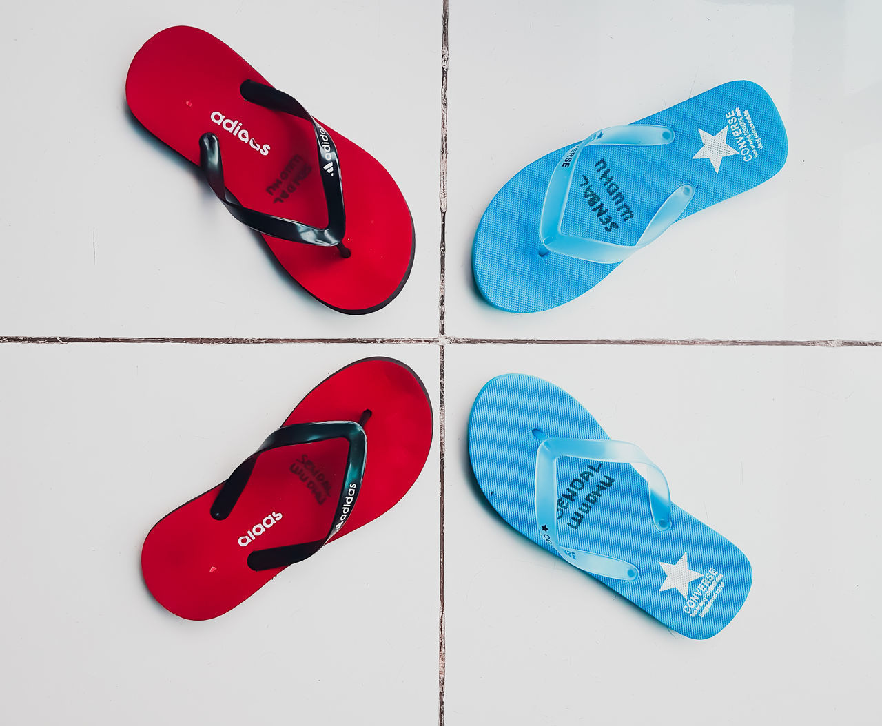 CLOSE-UP OF RED SHOES ON WHITE BACKGROUND