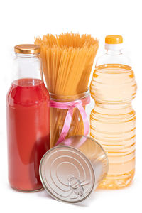 Close-up of bottles against white background