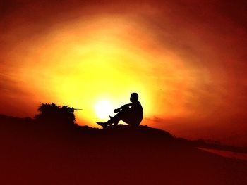 Silhouette of mountain against sunset sky