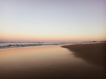 Scenic view of beach against clear sky