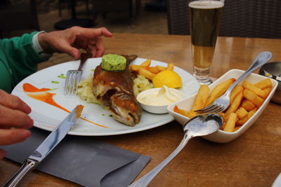 Close-up of man preparing food on table