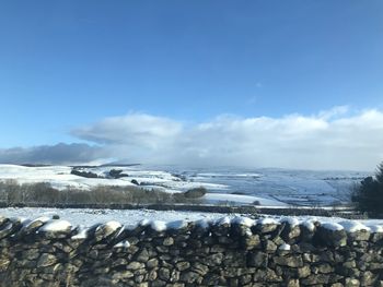 Scenic view of sea against sky during winter