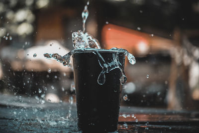 Close-up of water splashing on rainy season