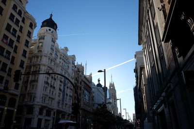 Low angle view of buildings against blue sky