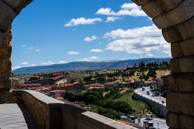 High angle view of city against cloudy sky