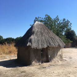 Built structure on field against clear sky