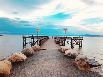 Pier over sea against sky
