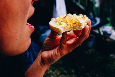 Close-up of man eating food