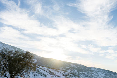 Beautiful clouds against the blue sky over the tien shan mountains in winter in uzbekistan