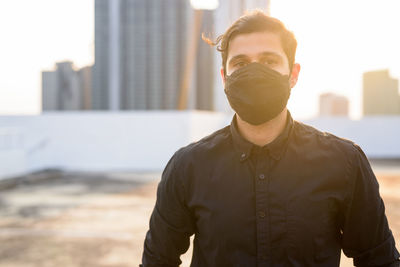 Portrait of man wearing mask outdoors