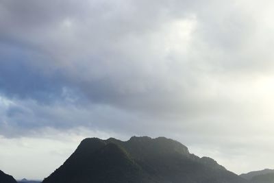 Low angle view of silhouette mountain against sky