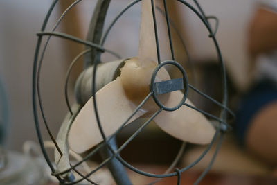 Close-up of electric fan on table