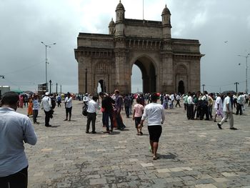 Group of people in front of historical building