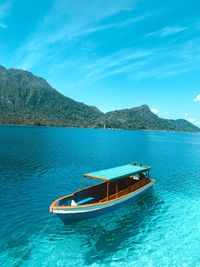 Scenic view of sea against blue sky