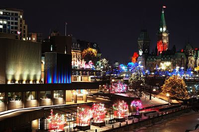 Parliament hill against sky in city during christmas at night