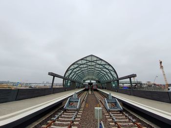 View of railroad station platform against sky