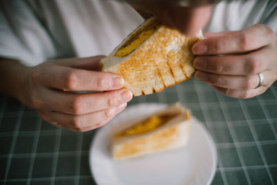 Cropped image of man eating breakfast