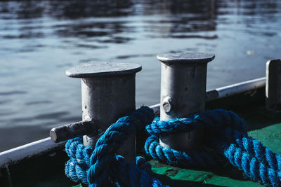 Close-up of rope tied on pier