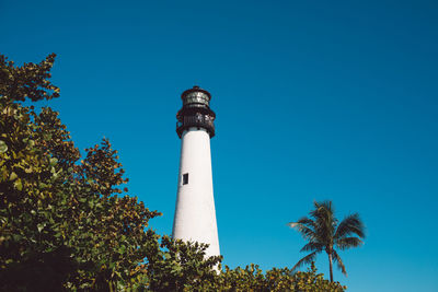 Low angle view of lighthouse against clear blue sky