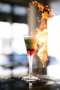 Fire by drink on bar counter
