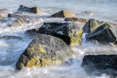 High angle view of rocks amidst sea