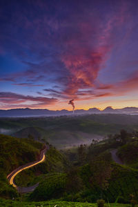 Scenic view of landscape against sky during sunrise