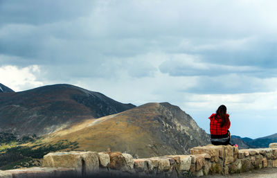 Scenic view of mountains against cloudy sky