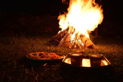Bonfire on field at night