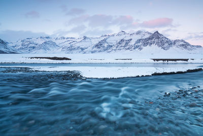 Scenic view of frozen sea against sky